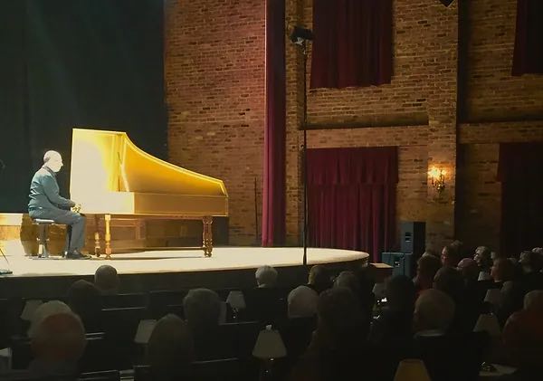 pianist on stage in Lexington's Village Theatre