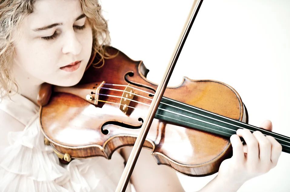 young woman playing a violin