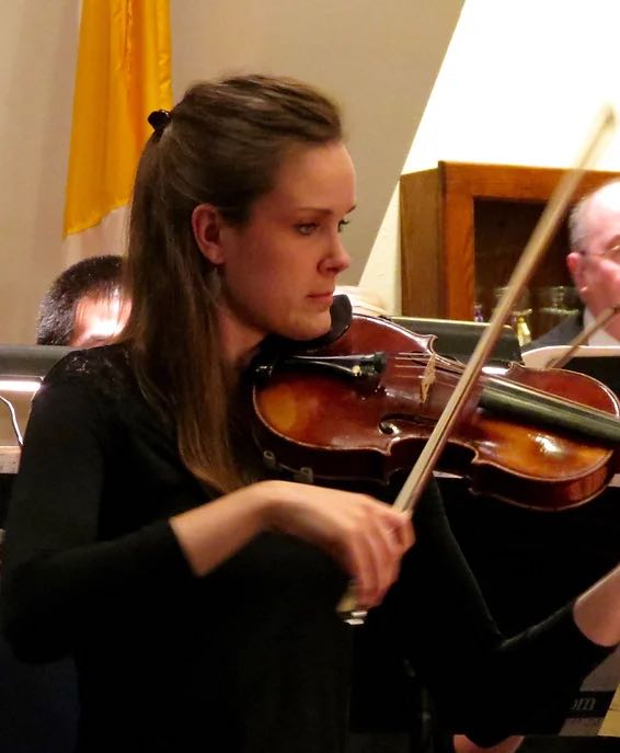 closeup of woman playing a violin