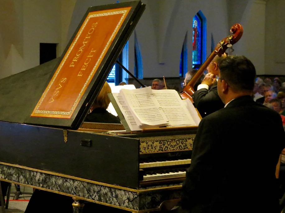 view of the orchestra and audience from behind the piano