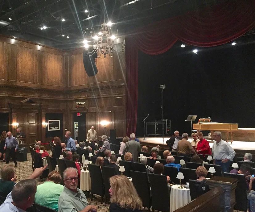 audience mingling before a performance at the Lexington Village Theatre